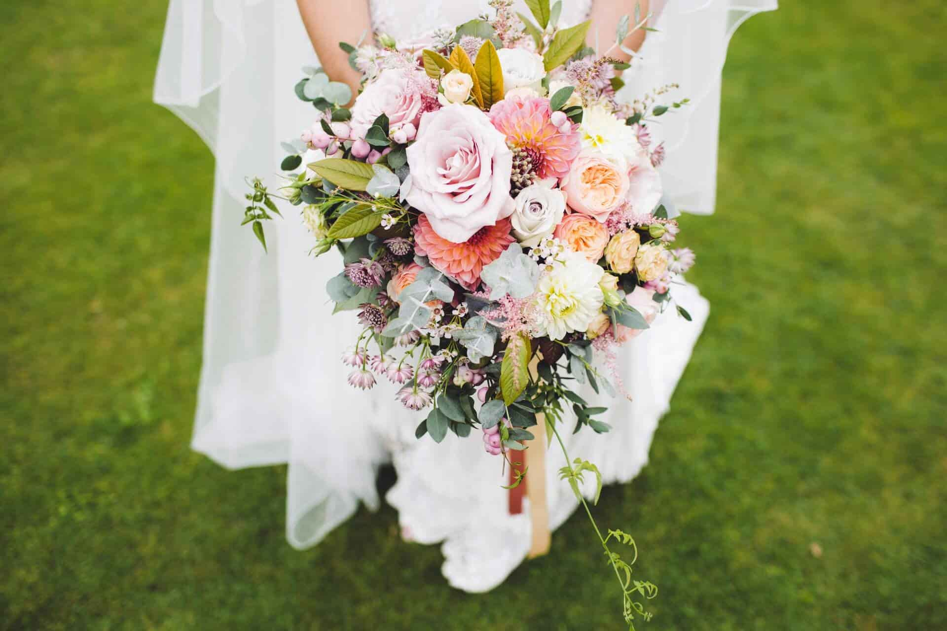 Wedding Bouquet with White Roses and Feather Accents