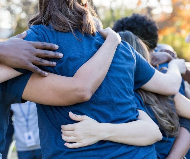 People in circle at religious retreat