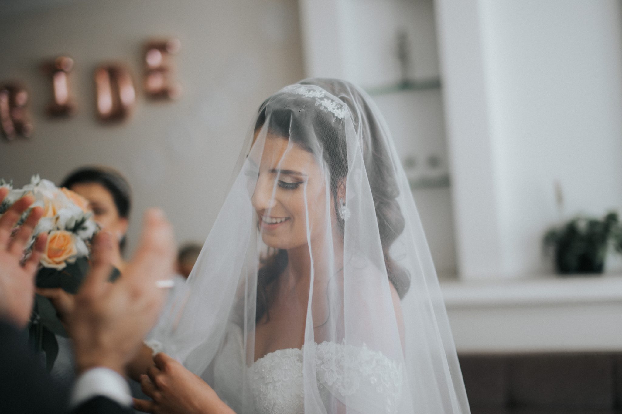 bride wearing veil at wedding venue